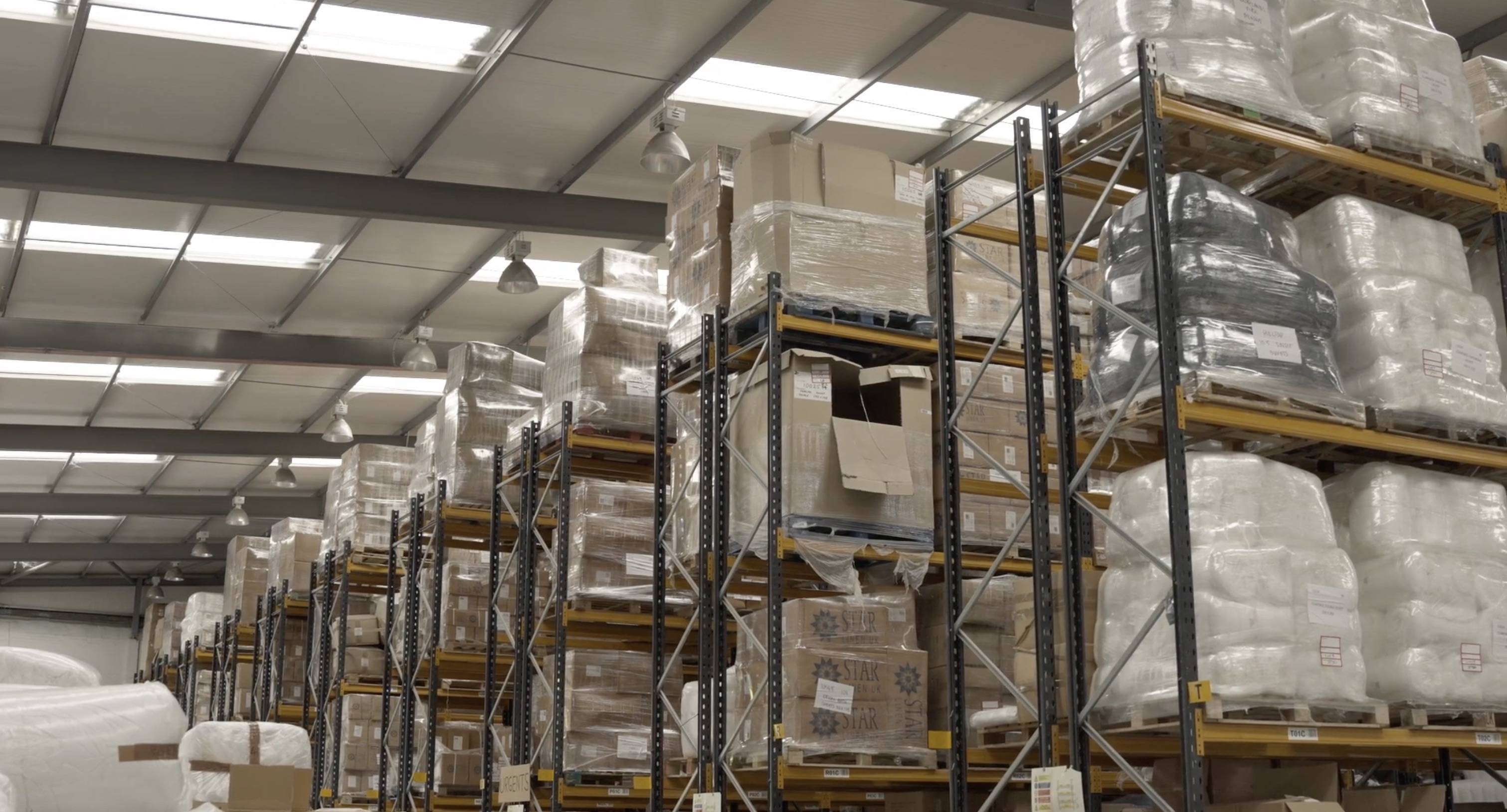 Star Linen warehouse team member in hi-vis vest